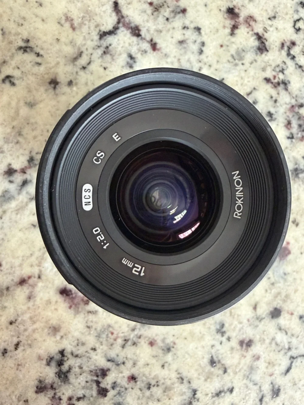 Rokinon 12mm F2 manual focus lens, with hood, and Drawstring Pouch. Sony E mount